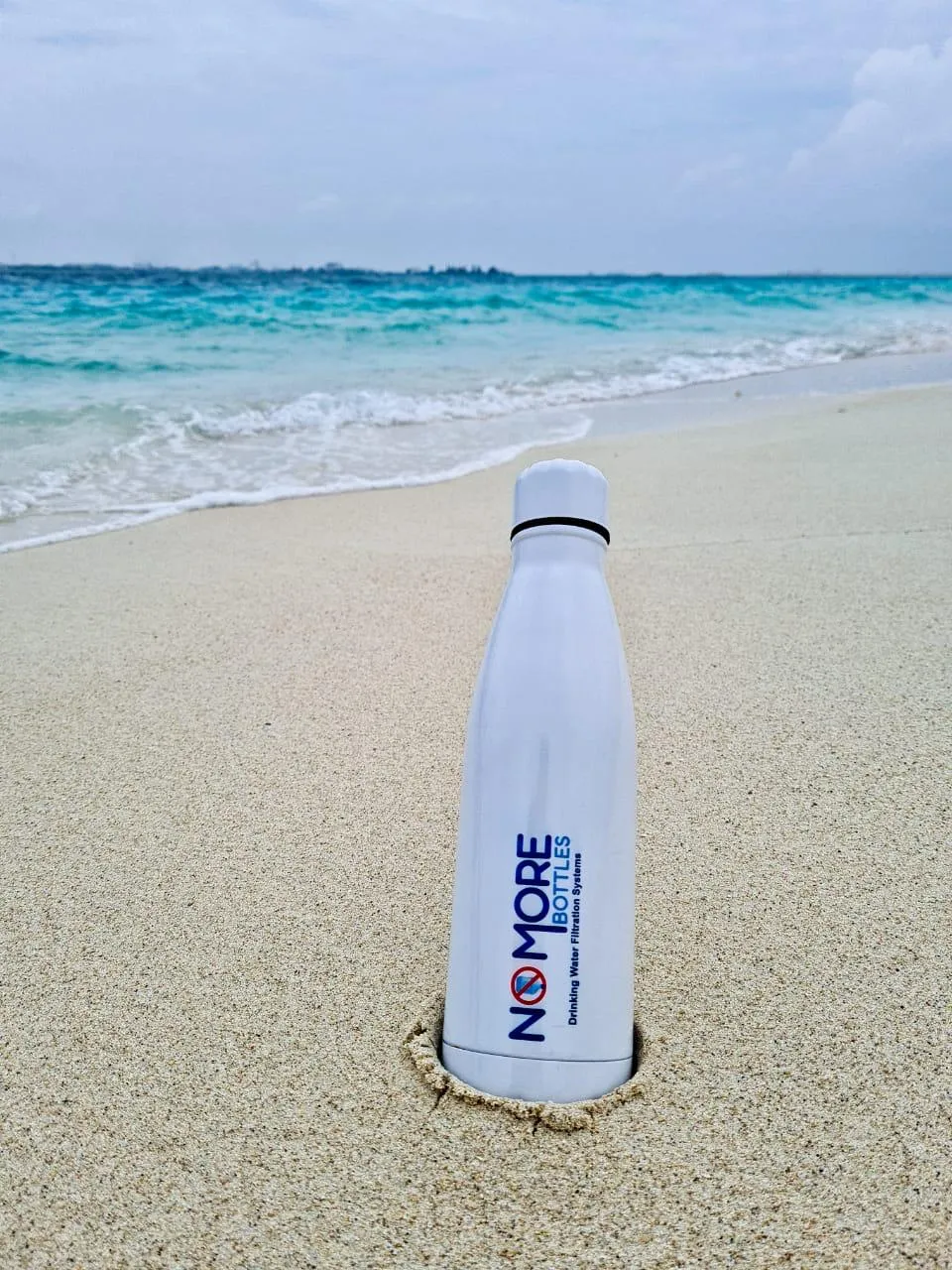 Photo of No More Bottles bottle on the beach